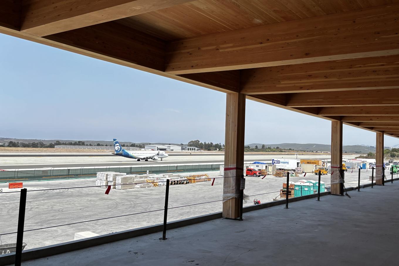 An Alaska Skywest flight passes the Gate 3 area of the concourse. 