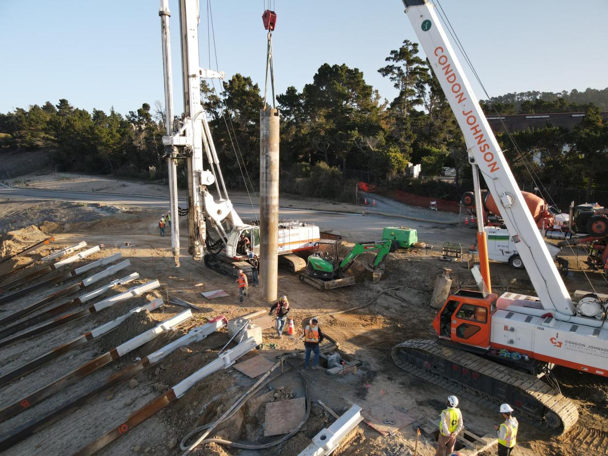 Pile casing being slowly lowered in.