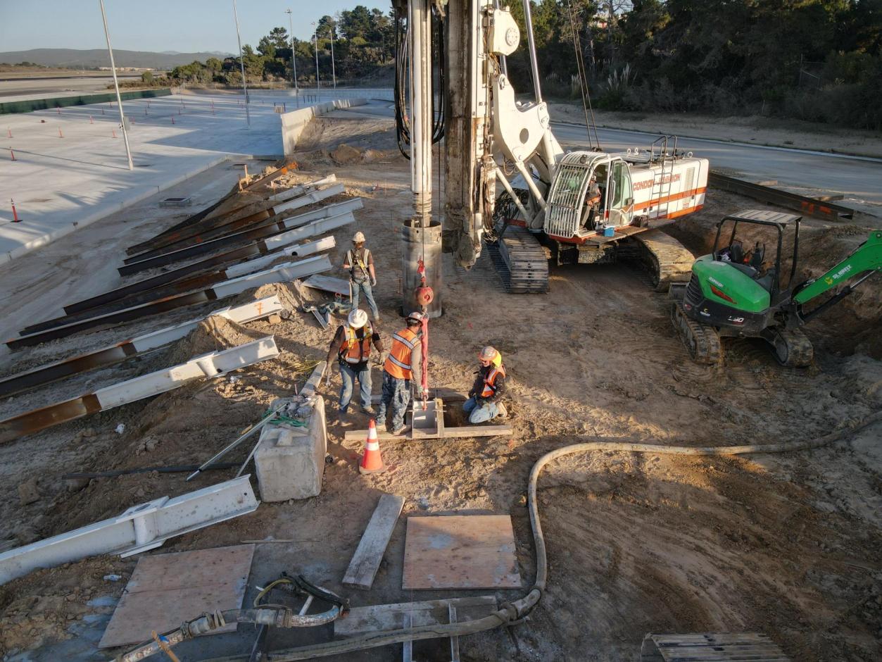 Workers securing the position of the piling.