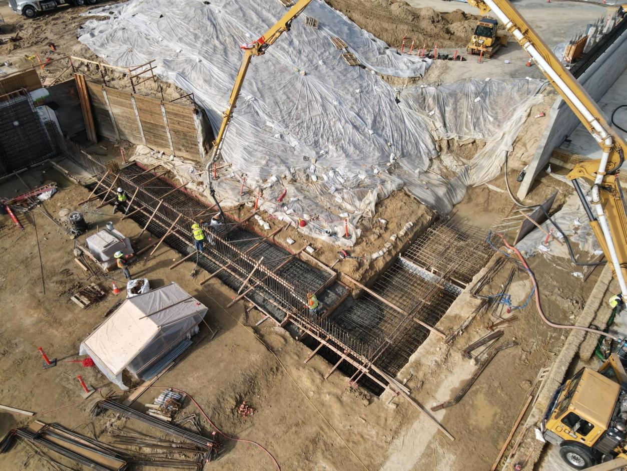 Western terminal wall footing being poured.