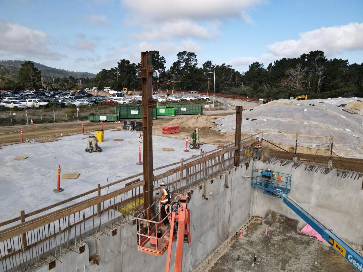 An ironworker secure the erected steel columns.