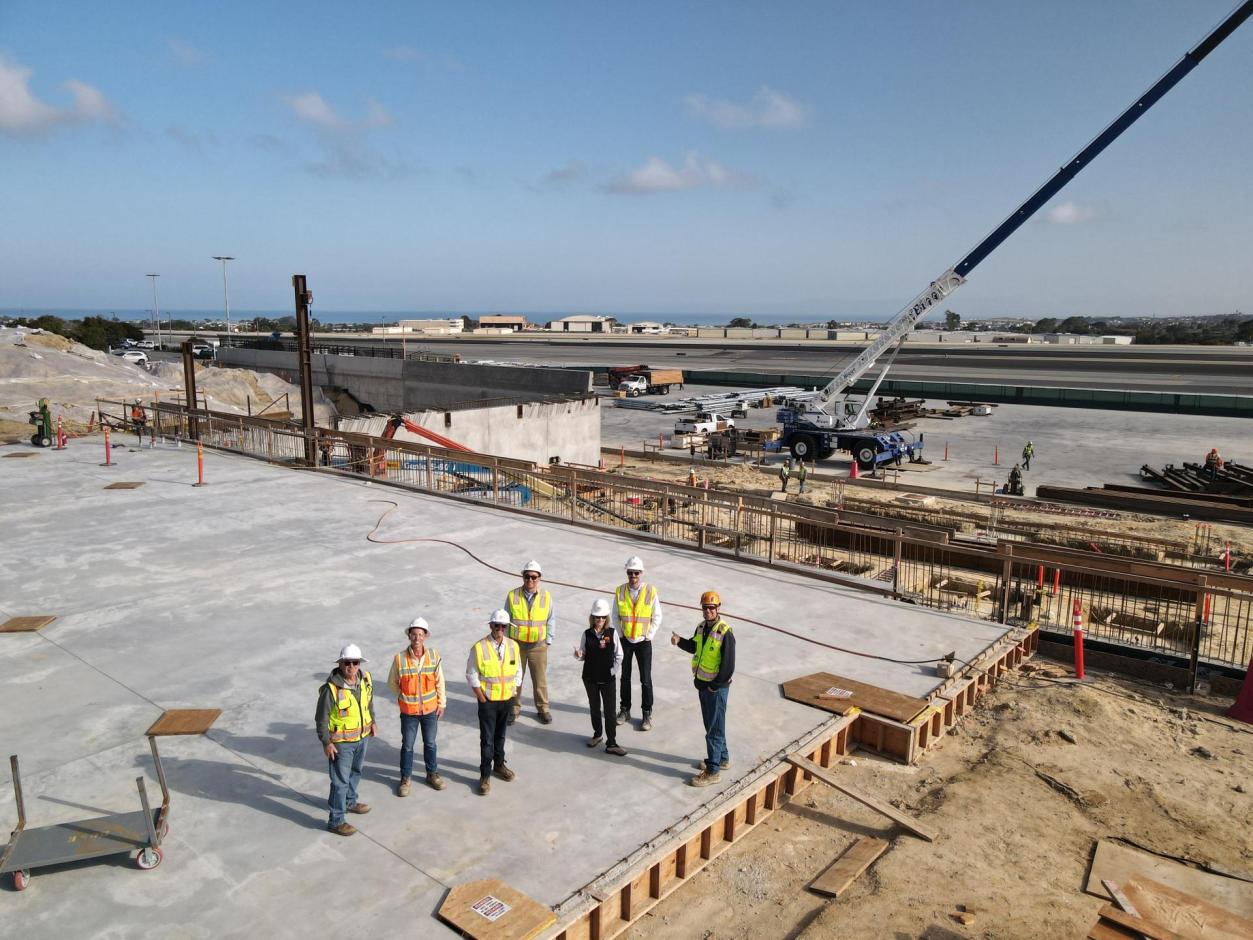 The MRY team and contracting members pose for a photo as they witness this historic occasion.