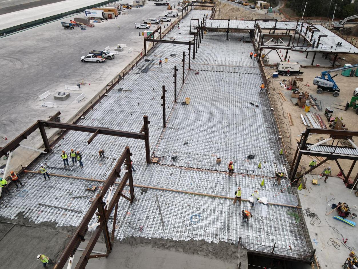 Contracting partners secure the metal decking rebar for the areas that are yet to be poured.