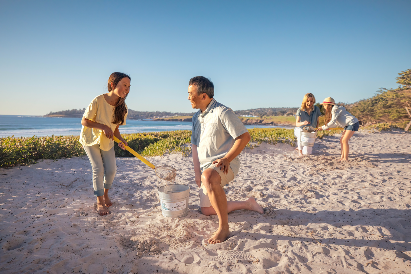 Lover's of Carmel Beach -- just one of the many ways that visitors can give back to help protect the region's unique coastal ecosystem.  Photo Credit: Visit Carmel
