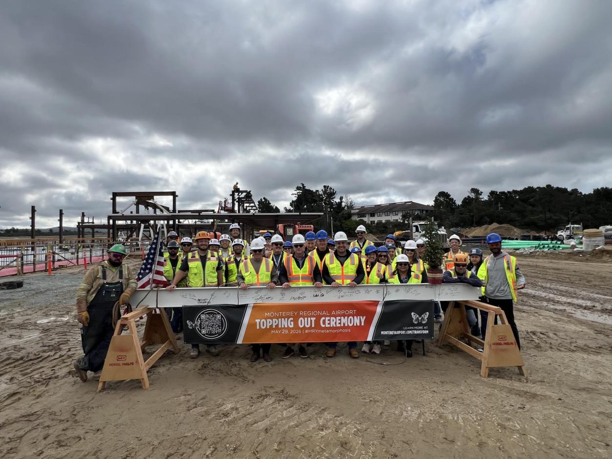 Stakeholders and airport staff pose for a group photo to mark this monumental milestone.