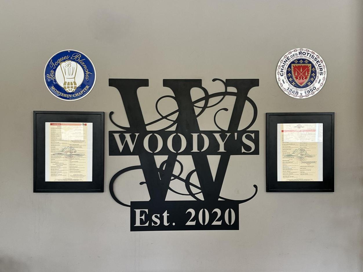 Woody's at the Airport Signage