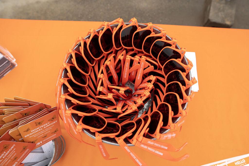 orange sunglasses for terminal groundbreaking event