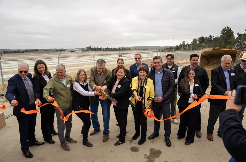 group of leaders cutting ribbon for terminal groundbreaking event