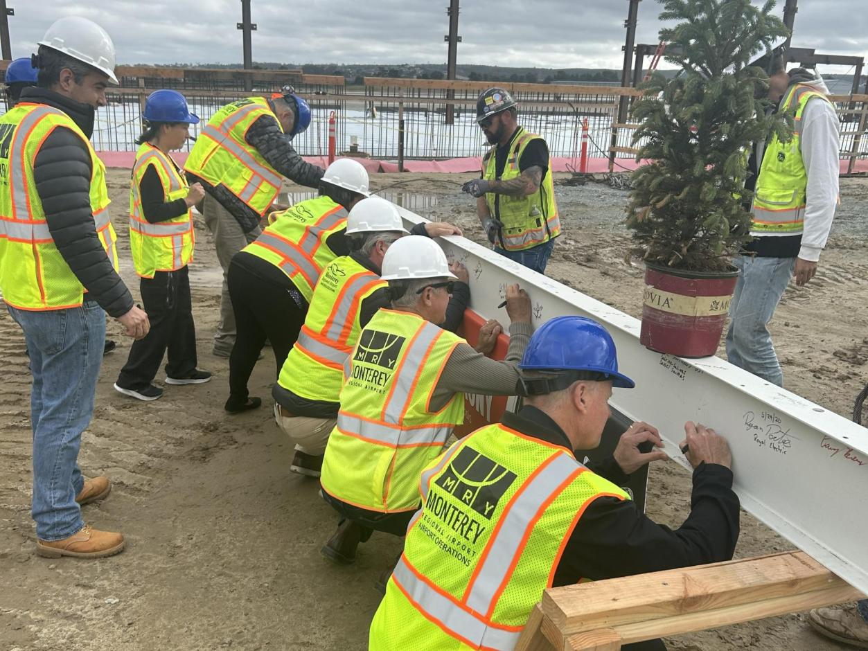 MRY Staff, Board Members and Contracting Partners sign the beam.