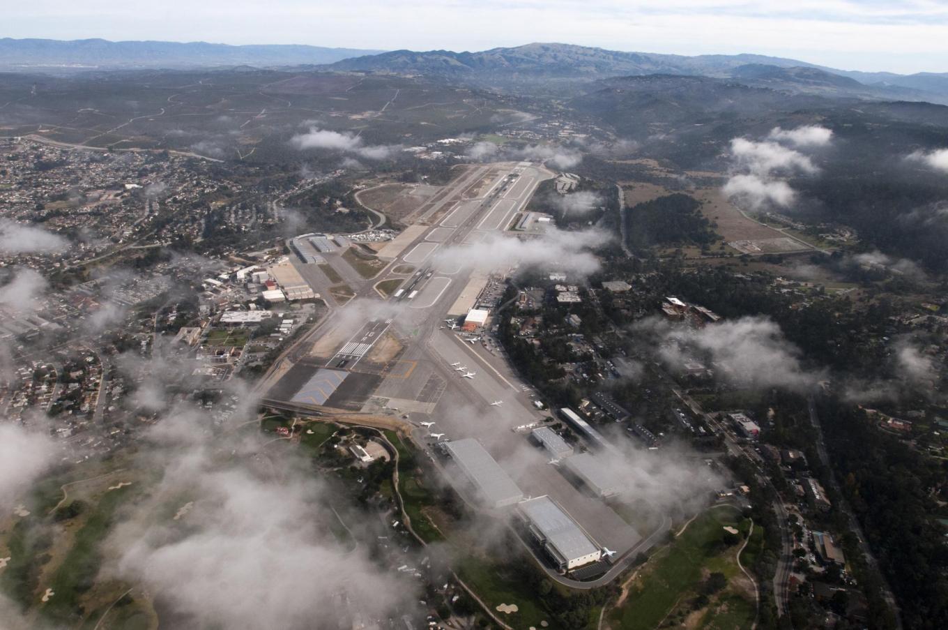 A northeast aerial view of the airport and airfield